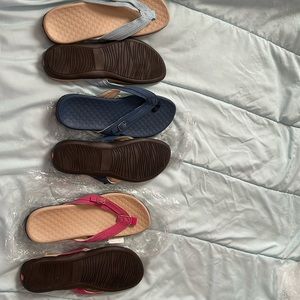 Brand new slide on flip flops size (size 8 )colors light blue/ navy blue / pink